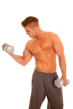 A man working out his body with weightsの写真素材
