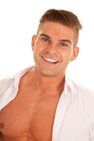 A man with a smile on his face with his shirt unbuttoned.の写真素材