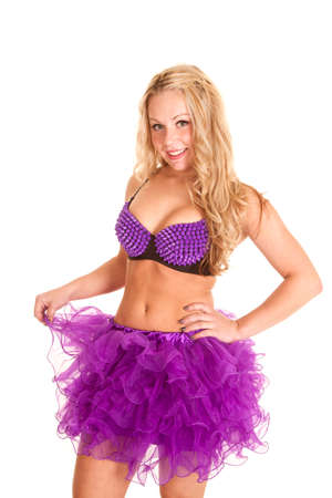 A woman in her purple tutu happy and smiling.  She is also wearing a spike bra.の写真素材