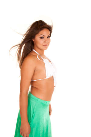 A woman in her fringe bra with a green skirt.の写真素材