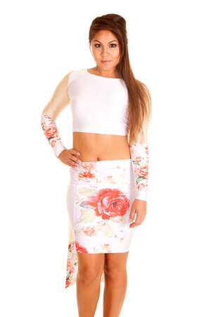 a woman in her flower skirt with long sleeve belly shirt.の写真素材