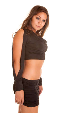 A woman in a short black skirt with a tube top, showing off her stomach.の写真素材