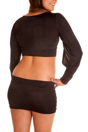 A woman in her black dress showing off her back.の写真素材