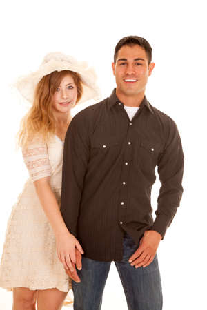 A man and woman standing to gether, holding hands.の写真素材