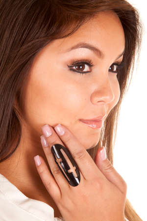 A woman looking to the side, and a black ring on her finger, with a cross design.
の写真素材