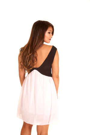 a woman showing off the back of her dress.の写真素材