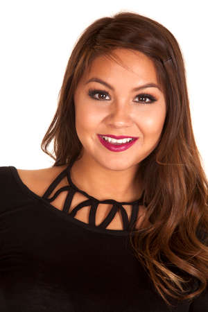 A woman with a smile, in a black top.の写真素材