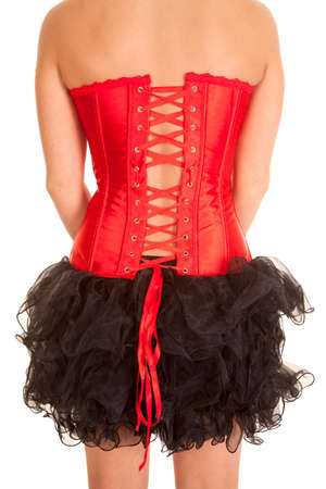 a woman showing off the back of her red corset and black tutu.の写真素材