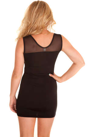 A woman with her back to the camera showing the back of the dress.の写真素材