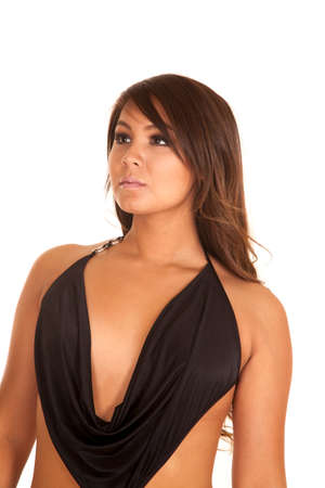 A woman in a low cut dress top, with a serious expression.の写真素材