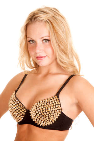 A woman in her bra with gold spikes.の写真素材