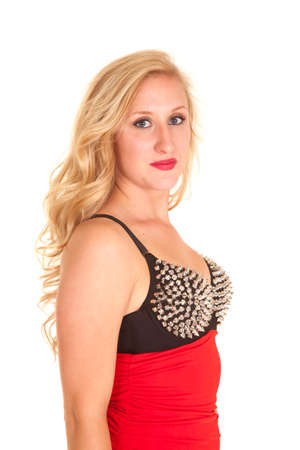 a woman in a red dress with the top silver spikes.の写真素材