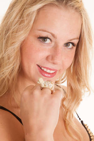 a woman with a smile , showing off her dog ring on her fingerの写真素材