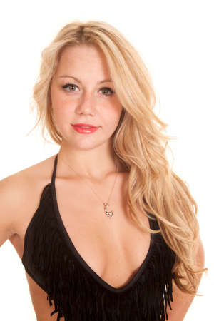 a woman with a black top wearing a necklace with a giraffe on it.の写真素材