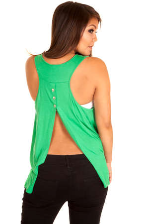 A woman in her open back tank looking over her shoulderの写真素材