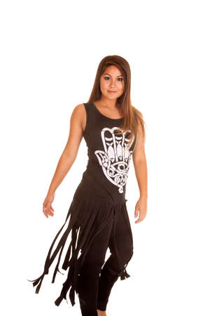 a woman with a black tank with a white design looking.の写真素材