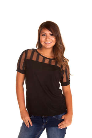a woman in her black top with her thumbs in her pockets.の写真素材