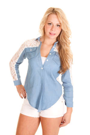 A woman in her white shorts wearing a jean top.の写真素材