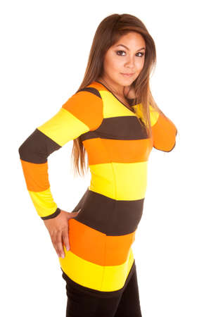 A woman in a yellow, orange and brown striped top.の写真素材
