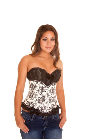 A woman in her white and black corset with bows on the side.の写真素材