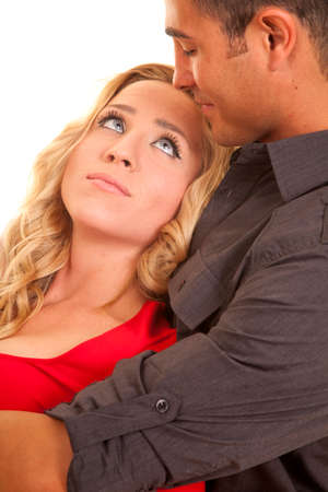 A woman leaning back into her man looking up at her man's face.の写真素材