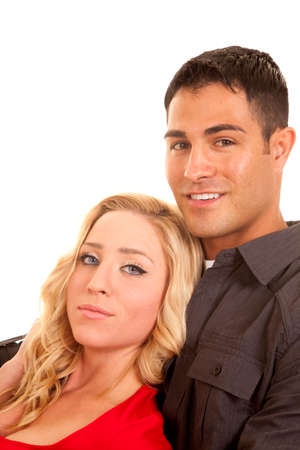 A woman leaning back onto a man's chest with a smile on his face.の写真素材