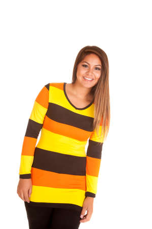 a woman in a top that is orange, yellow and brown.  It has the color of candy corn.の写真素材