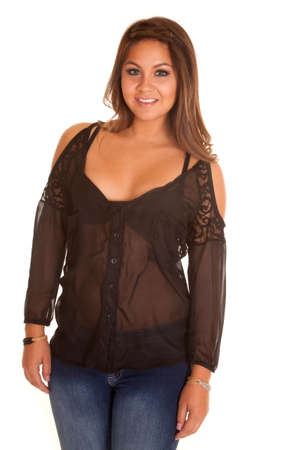 a woman in her sheer black top with a smile on her lips.の写真素材