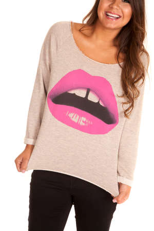 a woman with lips picture on the front of her sweater with a smileの写真素材