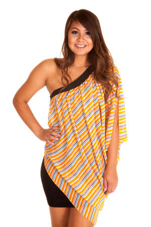 A woman with a smile on her face wearing her orange top.の写真素材