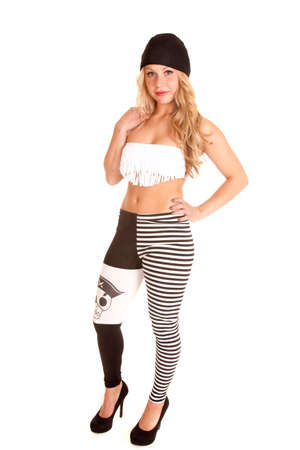 a woman in her pirate leggings and fringe bra, with a serious expression.の写真素材