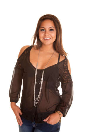A woman wearing a black sheer top with a silver necklace.の写真素材