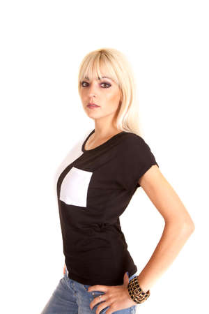 A woman in her black and white shirt, with a serious expression.の写真素材