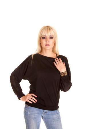 a woman in her black sweater wearing jewelry.の写真素材
