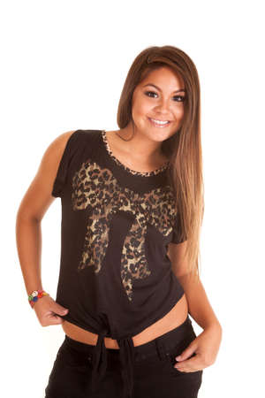 A woman in her brown top with a bow design on the front smile.の写真素材