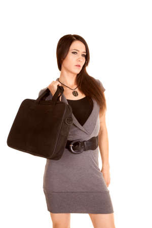 a woman in her business dress and carrying a briefcase.の写真素材