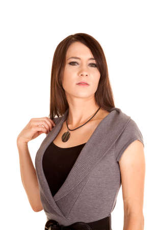 A woman with a serious expression on her face looking to the side.の写真素材