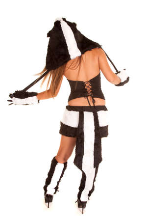 A woman showing off her tail in her skunk costume.の写真素材