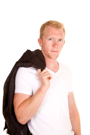 A man holding on to a leather jacket over his shoulder.の写真素材