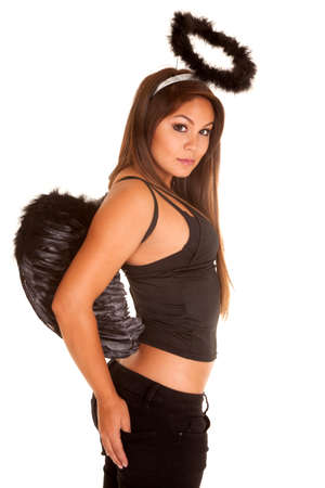 A woman with black wings and halo, with a seductive expression on her face.の写真素材
