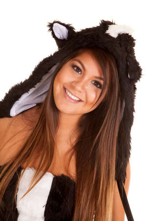 A close up of a woman in her skunk costume with a smile on her face.の写真素材