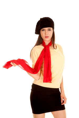 A woman holding out her scarf while wearing a French beret.の写真素材