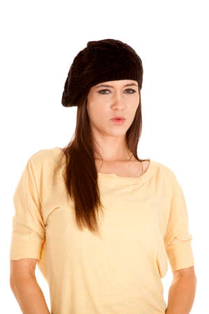 A woman in her yellow dress top with a beretの写真素材