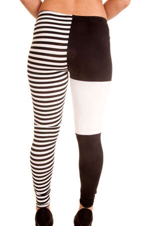 A woman showing off her back of her black and white leggings.の写真素材