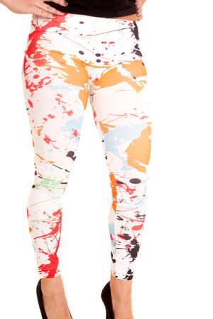 A woman in her white paint splat leggings standing.の写真素材
