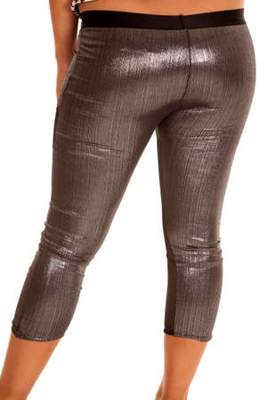 A woman in her shiny gray leggings with her back to the camera.の写真素材