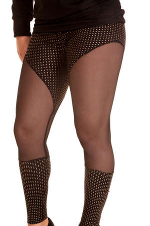 A woman wearing her sheer leggings showing off her legs.の写真素材