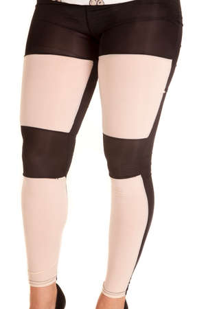 A woman in her whtie and black leggings, sheer.の写真素材