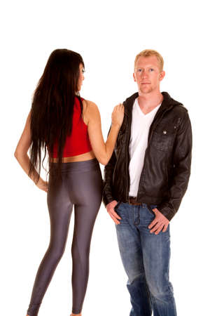 A woman with her back to the camera, with her hand on her man's shoulder.の写真素材