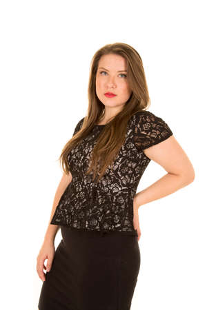 a woman in her black lace top, with a black skirt.の写真素材